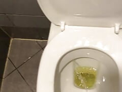 Pissing all over a toilet in a cafe